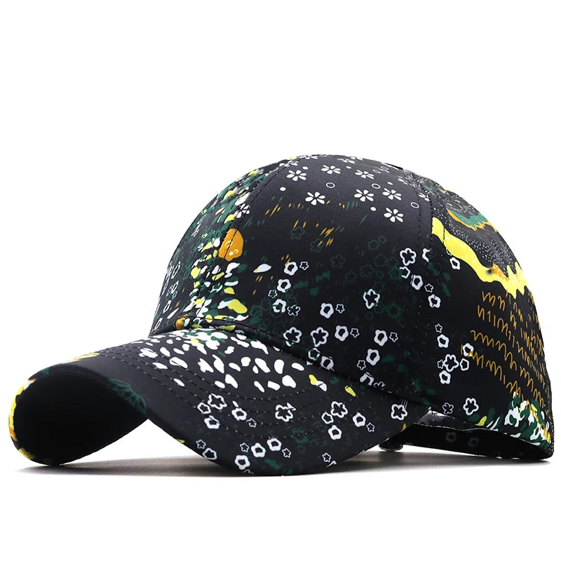 Black washed graffiti snapback cap by VOIDWEAR, featuring ritual-inspired embroidery and adjustable cotton fit, designed for global streetwear style. Floral-patterned baseball cap on a white background