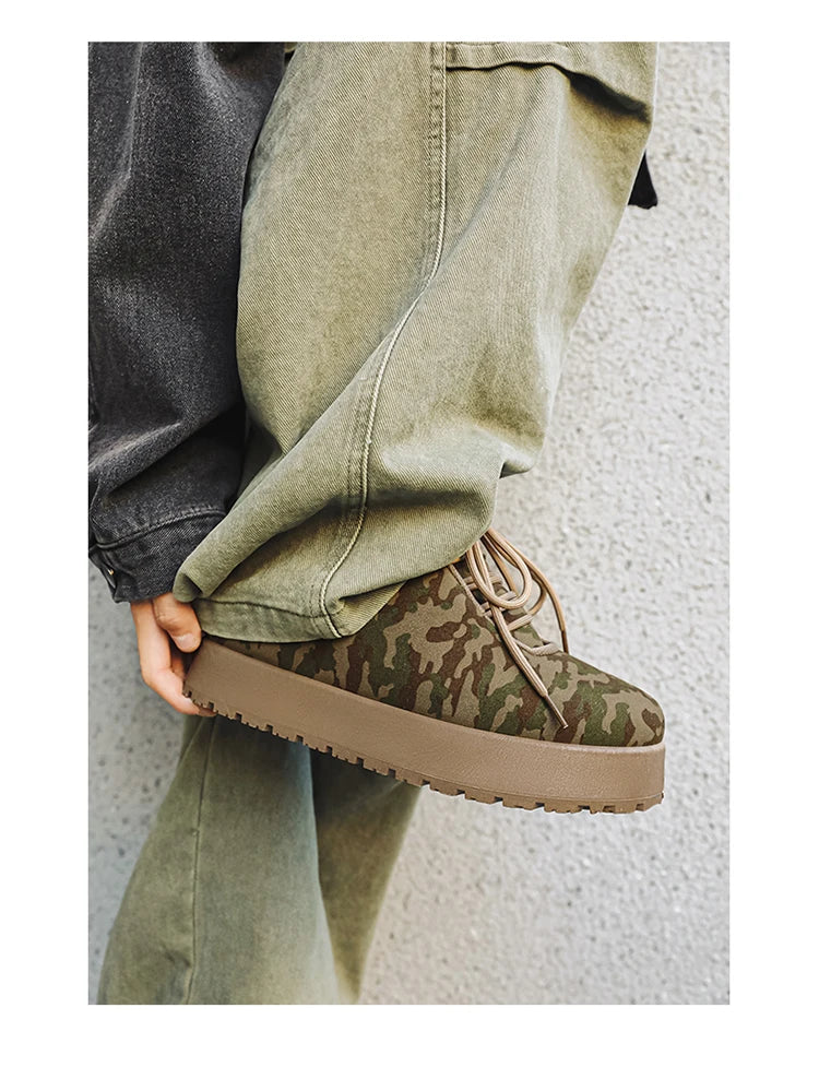 Men’s VOIDWEAR VDR_VANISH_02 shadow winter boots with platform sole, microfiber leather, and ritual-inspired design, styled for urban streetwear. Camouflage sneaker worn with a casual outfit against a neutral background