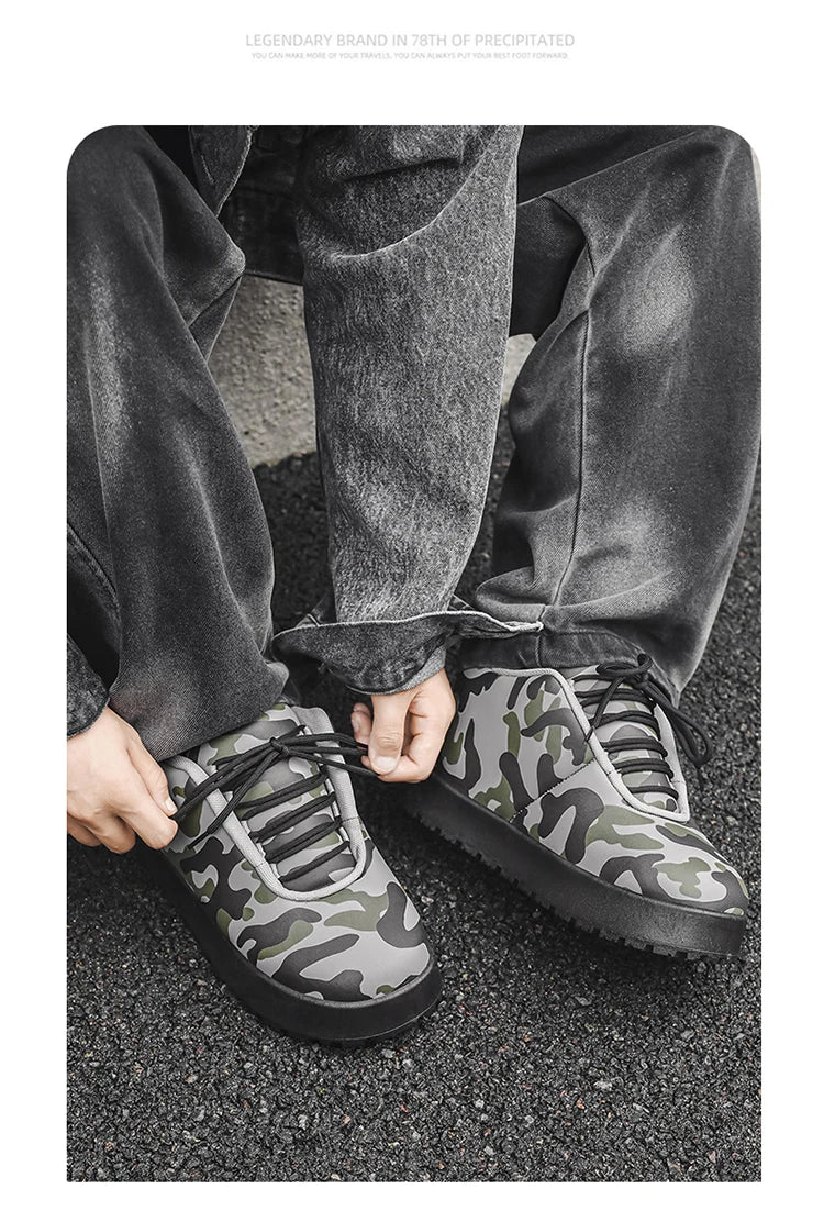 Camouflage sneakers worn with gray pants on a dark surface. VOIDWEAR CODE_SYSTEM_07 ⚔️ chunky sneaker-style boots shown on a city street in winter, highlighting the microfiber leather upper and thick platform sole.
