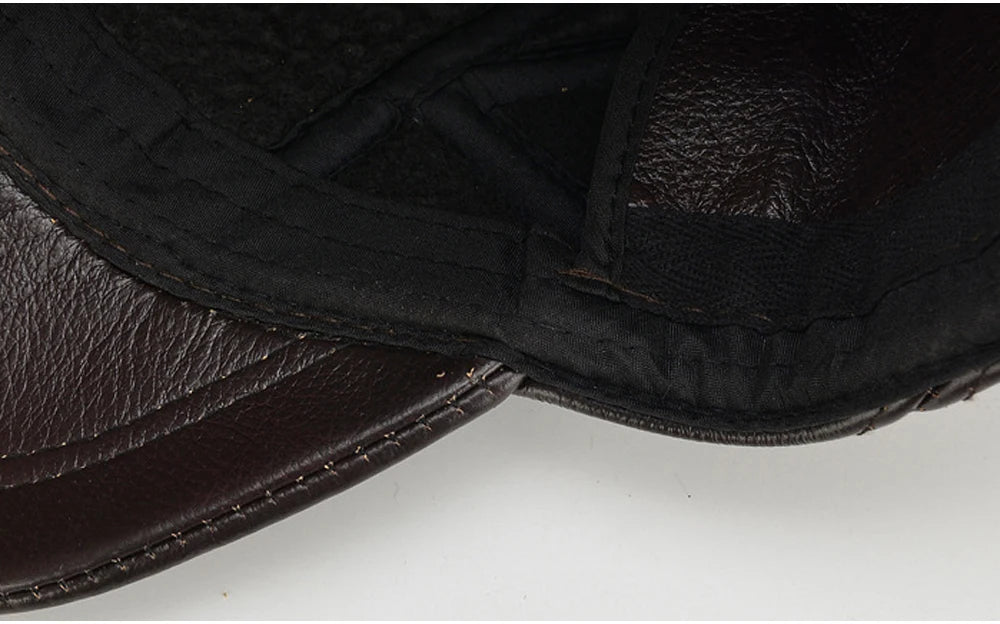 Close-up of a black leather saddle pad on a white background