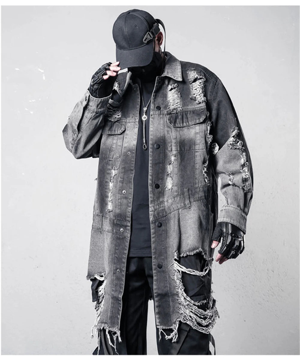 VOIDWEAR VDR_SIGNAL_07 Ritual Jacket — distressed long denim coat with ripped holes, glyph detailing, and loose high-street fit.