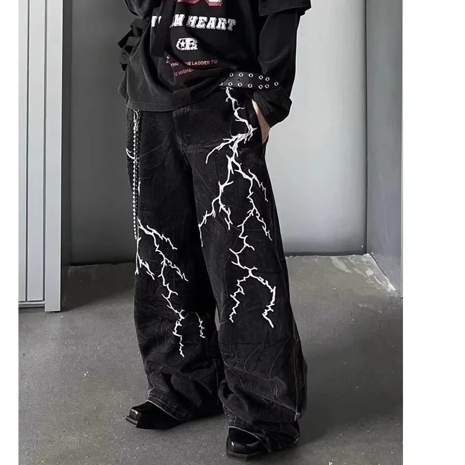 VOIDWEAR SIGNAL_STORM_07 ⚡ embroidered lightning jeans worn on Brooklyn rooftop at dusk, vintage wash visible on loose straight cut