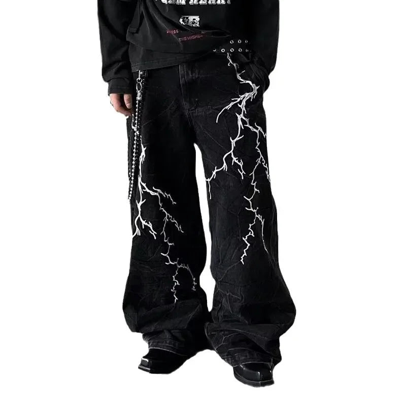 VOIDWEAR SIGNAL_STORM_07 ⚡ embroidered lightning jeans worn on Brooklyn rooftop at dusk, vintage wash visible on loose straight cut