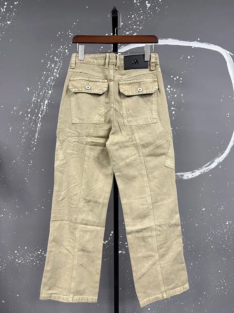 VDR_ Beige pants on a hanger against a gray background