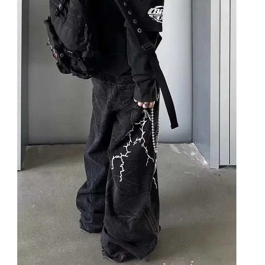 VOIDWEAR SIGNAL_STORM_07 ⚡ embroidered lightning jeans worn on Brooklyn rooftop at dusk, vintage wash visible on loose straight cut