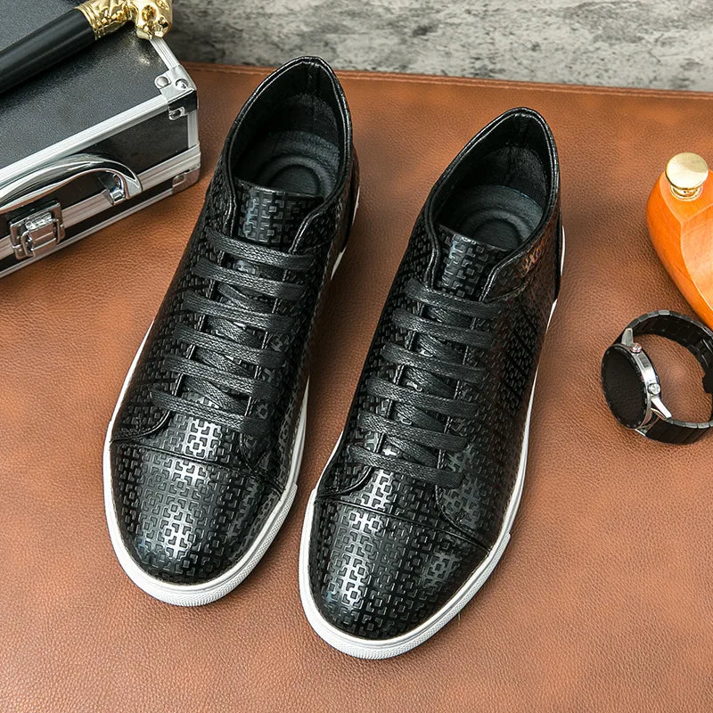 Black patterned sneakers on a brown surface with a watch and orange bottle in the background.VOIDWEAR SYSTEM_MOTION_07 ⏚ high-top sneakers, crafted from breathable PU leather with a subtle print, shown on a man in a modern streetwear outfit.