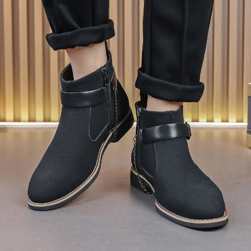 Black ankle boots worn with black pants on a neutral background. VOIDWEAR SIGNAL_VANISH_09 ☰ waterproof PU suede Chelsea-inspired streetwear boots with lace-up closure and ritual shadow-tech aesthetic