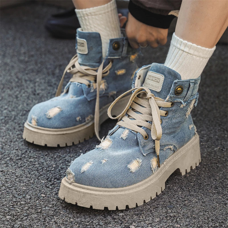 VOIDWEAR SIGNAL_VANISH_12 ☰ men’s denim ankle boots with lace-up closure, EVA insole, rubber outsole, ritual-inspired streetwear design. Blue denim boots with worn details on a pavement surface