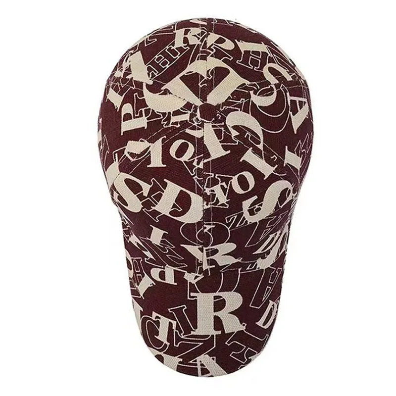 Maroon head cover with beige letter pattern on a white background