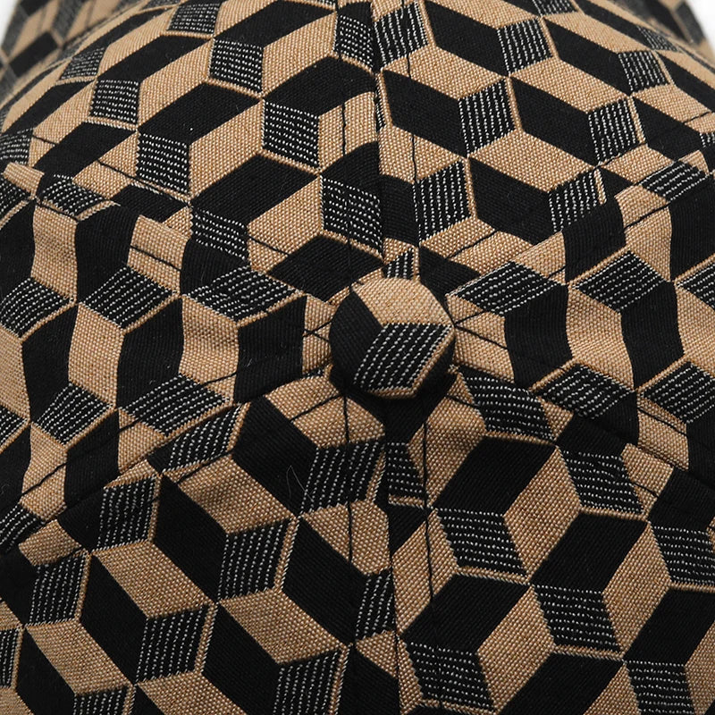 VOIDWEAR SIGNAL_CAP_11 ☰ washed cotton streetwear baseball cap with embroidered glyph and adjustable strap, unisex ritual-inspired headwear. Close-up of a fabric with a geometric black and brown pattern