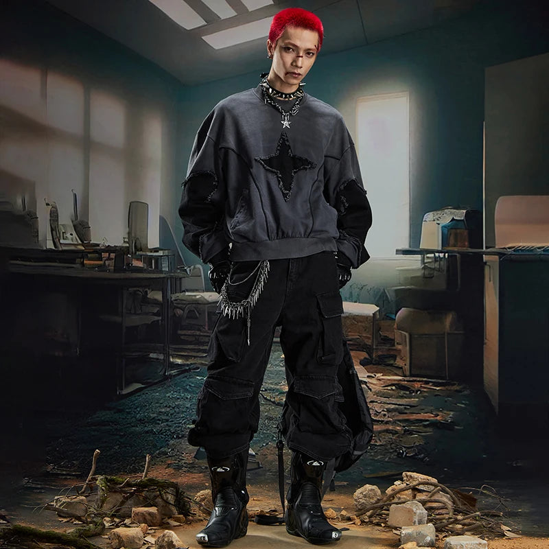 VOIDWEAR SIGNAL_BURR_07 ☰ long sleeve worn in Berlin underpass; star patchwork visible across chest, matte lighting accentuating texture