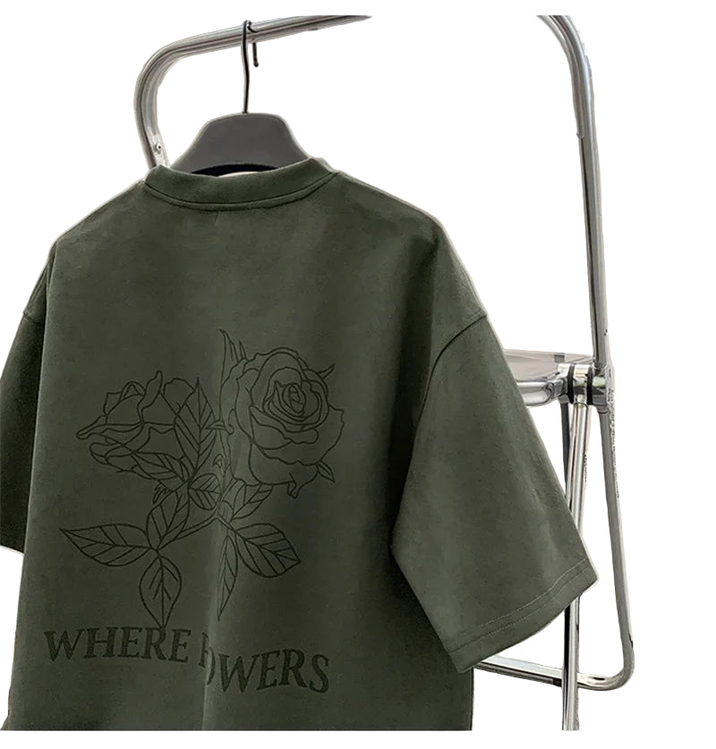 VOIDWEAR VDR_FLO_09 oversized goth floral graphic t-shirt in apricot, styled for streetwear layering. Green t-shirt with rose design and text on a hanger