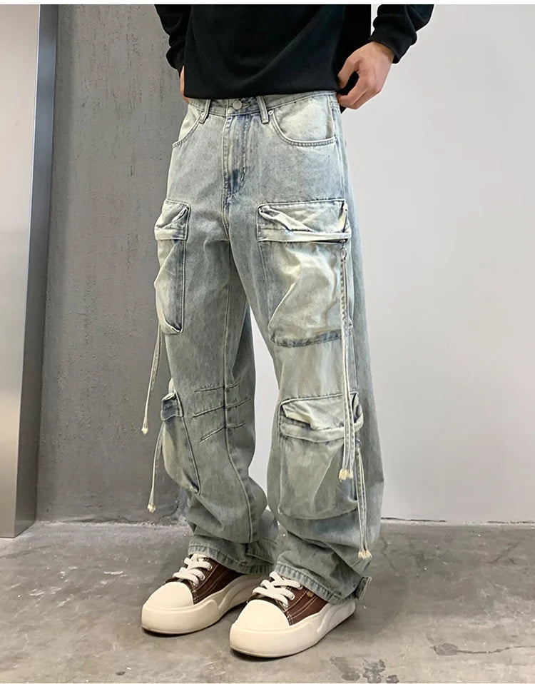 VOIDWEAR SIGNAL_CITY_09 ☰ cargo denim worn in Tokyo side street, multi-pocket structure visible under urban light.