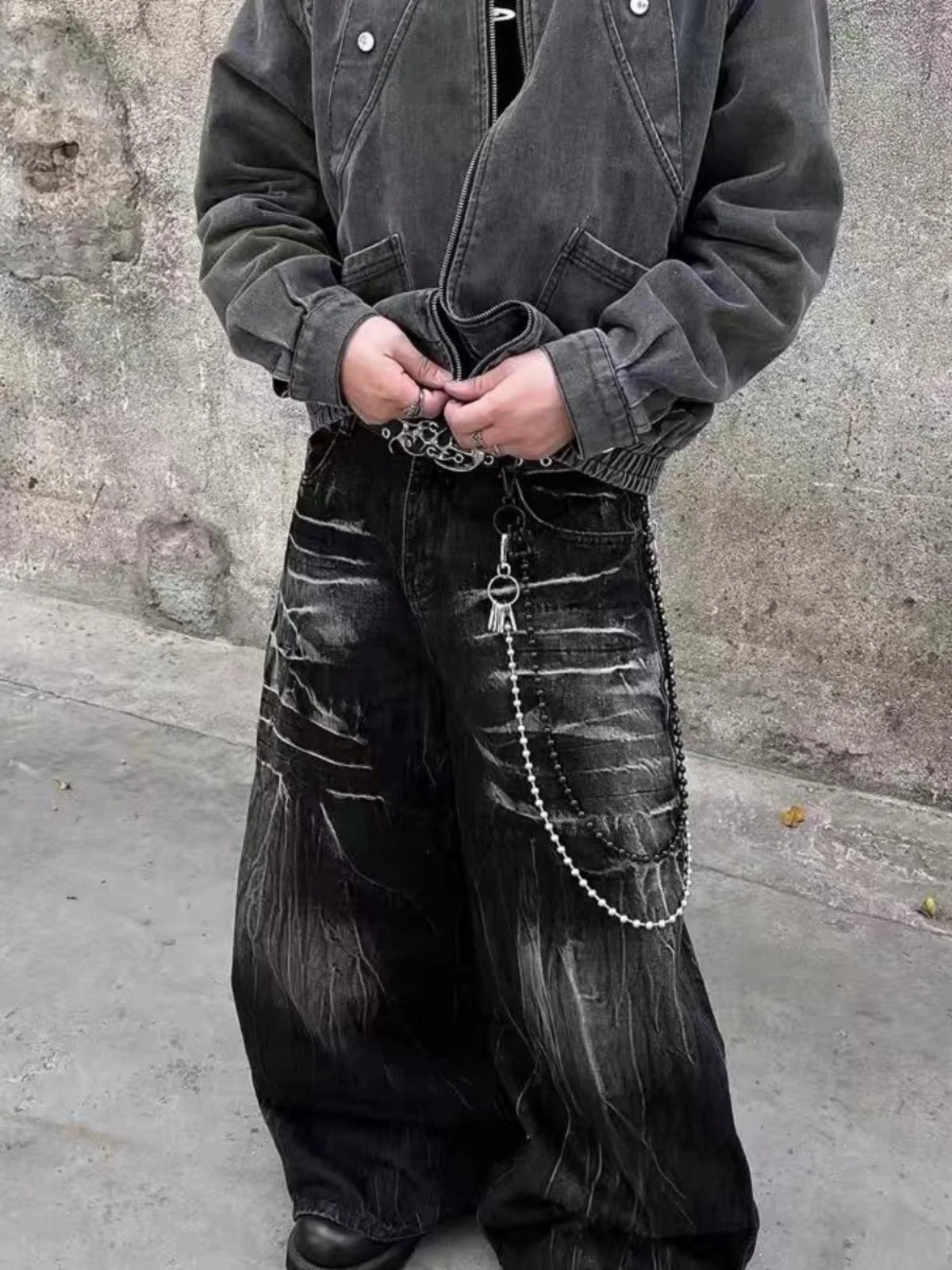 VOIDWEAR SIGNAL_STORM_11 ☰ black lightning jeans shown in Los Angeles alleyway — washed denim texture and storm pattern visible under sunlight.
