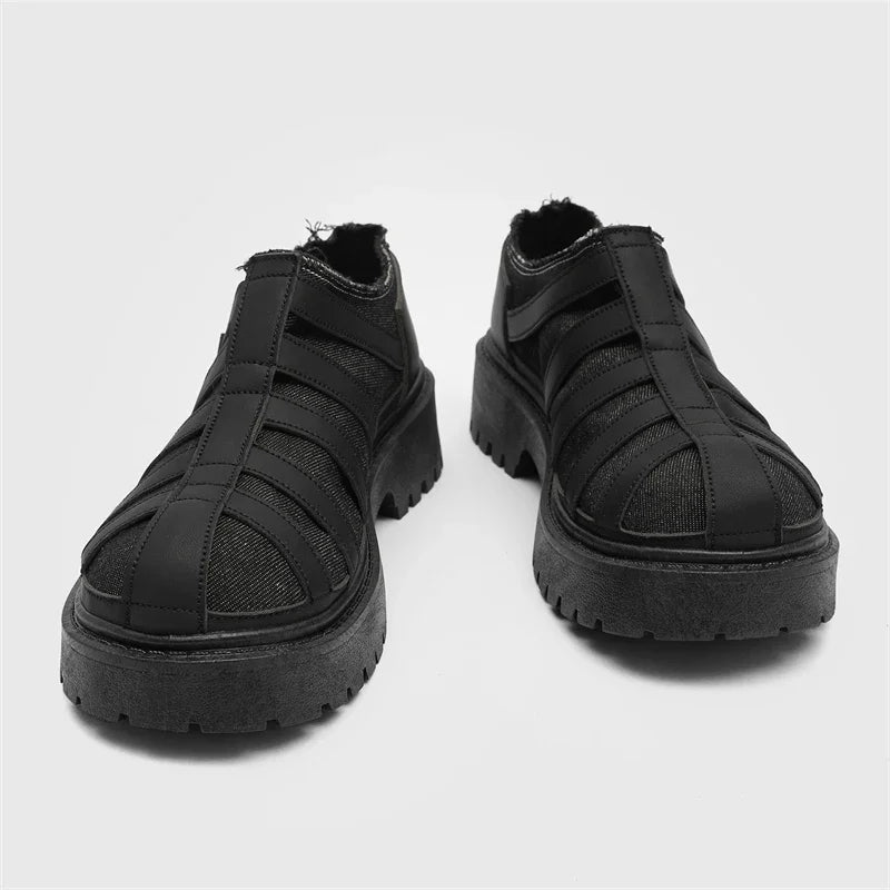 VOIDWEAR SIGNAL_VANISH_12 ☰ men’s split leather casual shoes with stitched upper, rubber sole, and ritual-inspired minimalist design.. Pair of black platform shoes on a light gray background