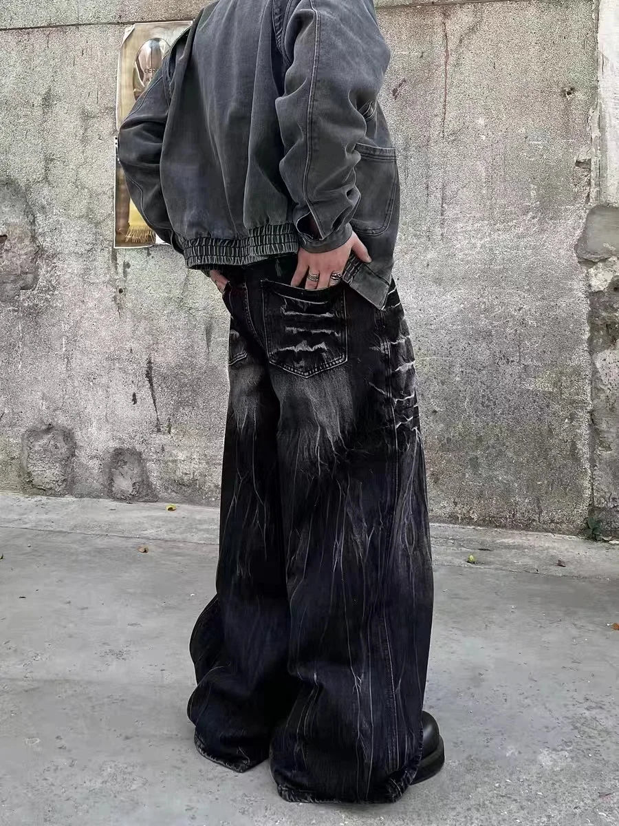 VOIDWEAR SIGNAL_STORM_11 ☰ black lightning jeans shown in Los Angeles alleyway — washed denim texture and storm pattern visible under sunlight.