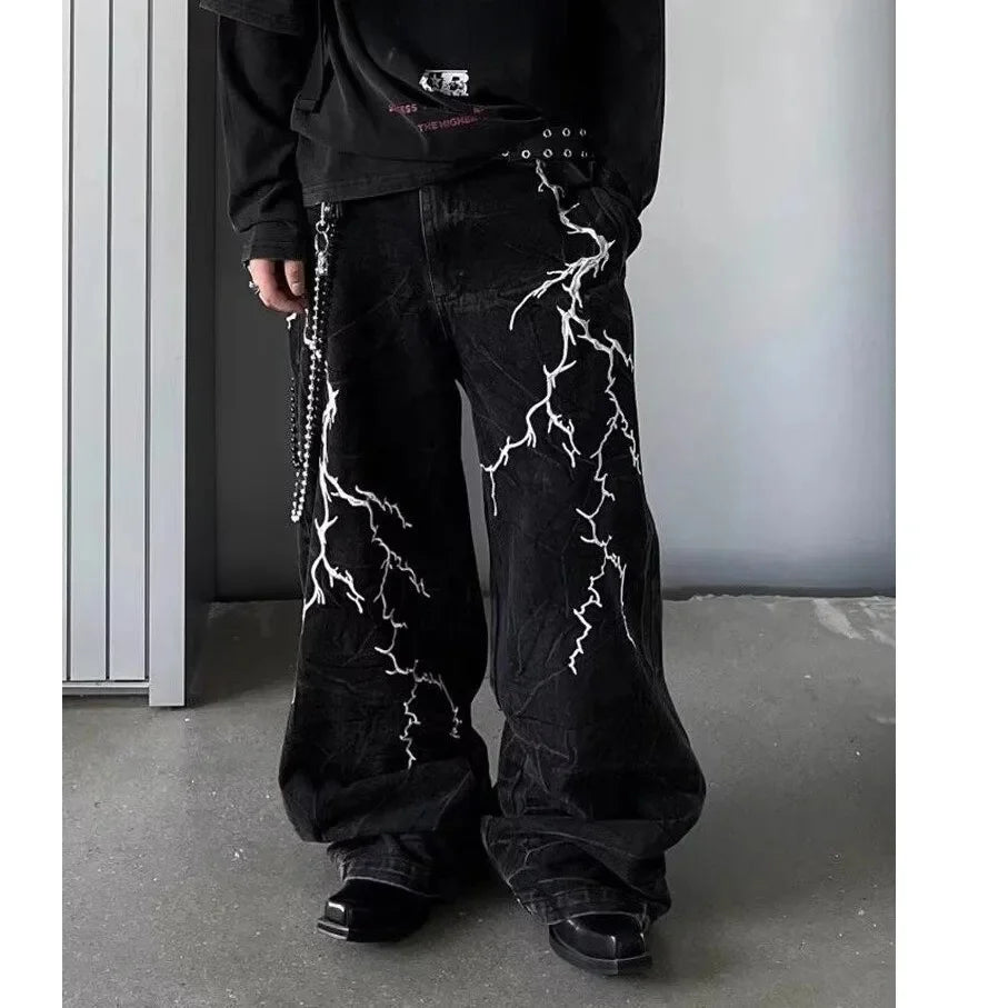 VOIDWEAR SIGNAL_STORM_07 ⚡ embroidered lightning jeans worn on Brooklyn rooftop at dusk, vintage wash visible on loose straight cut