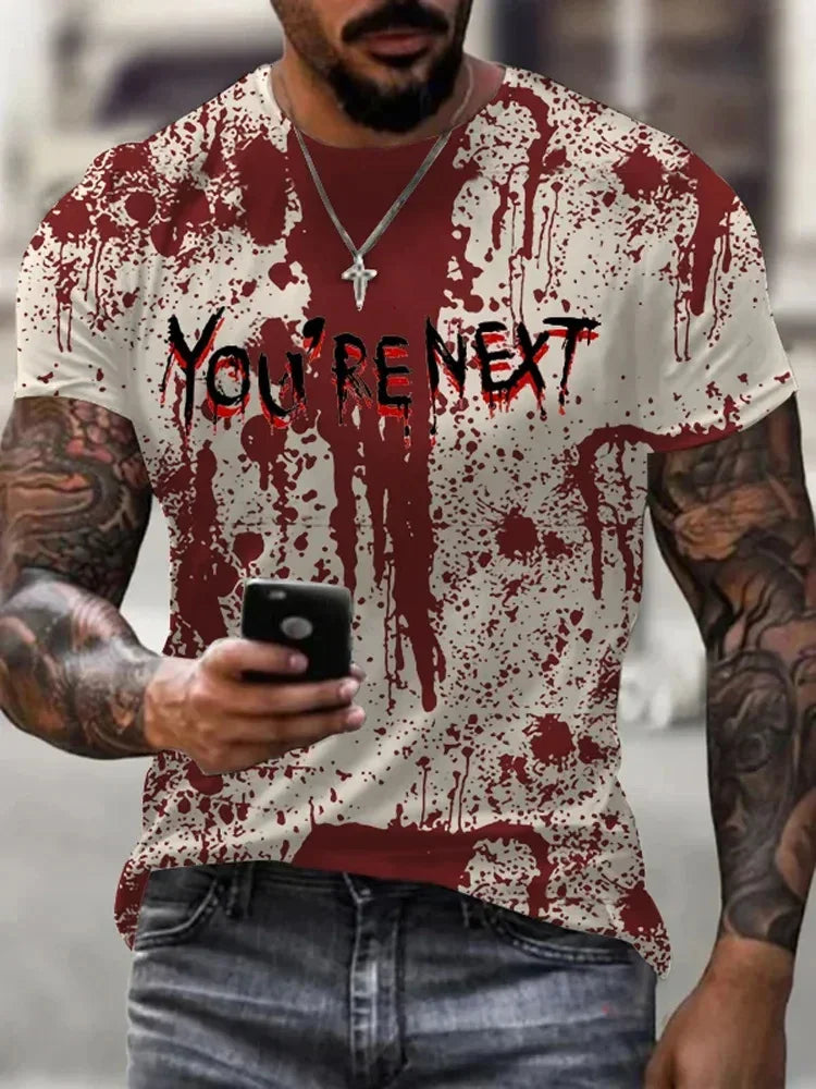 Person wearing a t-shirt with 'You're Next' graphic and blood-like design.