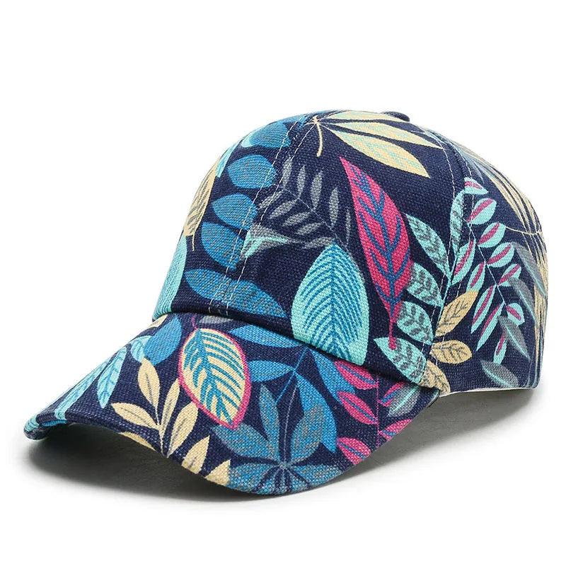VOIDWEAR Ritual-Inspired Streetwear. Navy blue cap with colorful leaf pattern on a white background