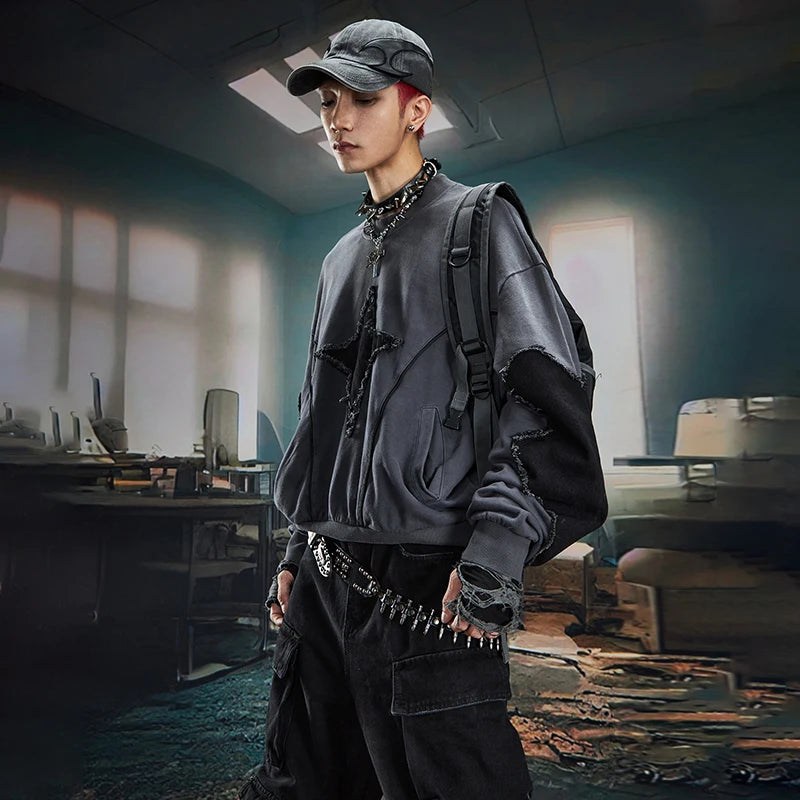 VOIDWEAR SIGNAL_BURR_07 ☰ long sleeve worn in Berlin underpass; star patchwork visible across chest, matte lighting accentuating texture