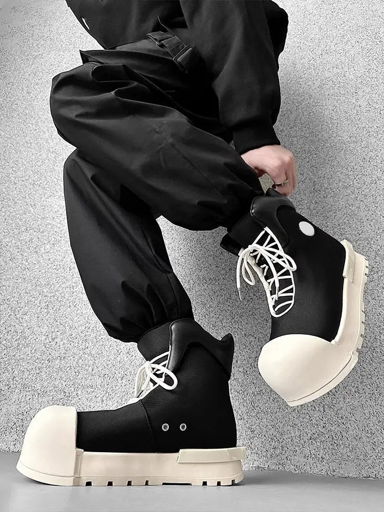 VOIDWEAR SIGNAL_SHADOW_09 ⍚ black high-top platform boots photographed in a concrete Berlin underpass, glyph-coded laces visible
