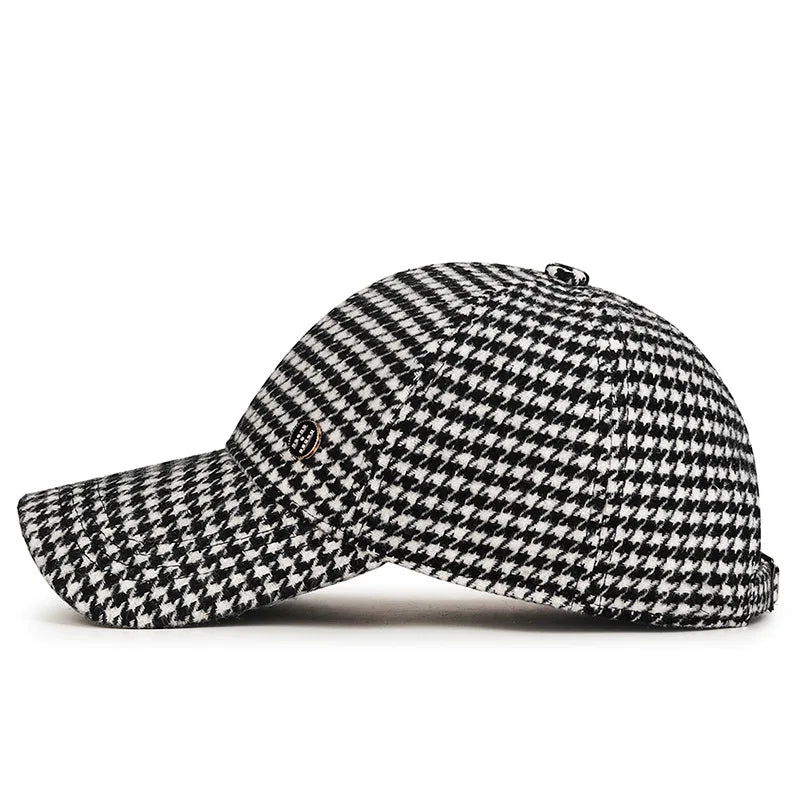 VOIDWEAR SIGNAL_SHADOW_07//◐ houndstooth plaid baseball cap with diamond label insignia and adjustable strap, styled in urban U.S. winter setting.
