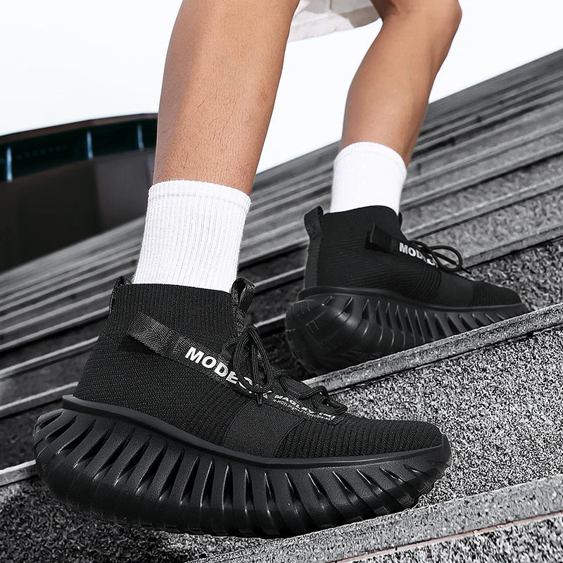 VOIDWEAR SIGNAL_VANISH_07 mesh sneakers, lightweight breathable techwear-inspired streetwear shoes with ankle wrap design. Black Mode shoes worn by a person on a metal surface