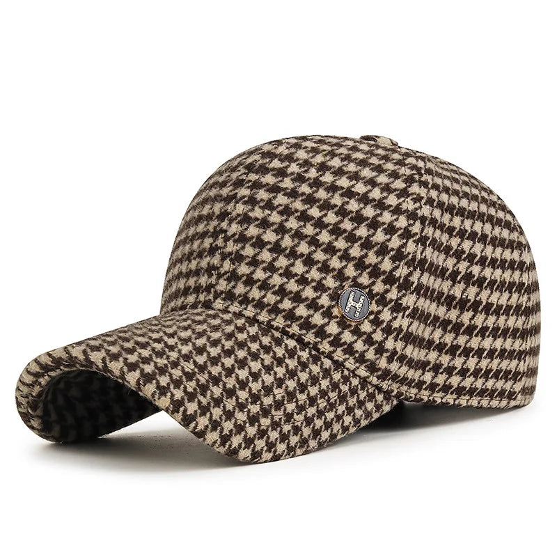 VOIDWEAR SIGNAL_SHADOW_07//◐ houndstooth plaid baseball cap with diamond label insignia and adjustable strap, styled in urban U.S. winter setting.. Houndstooth pattern cap with a small logo on a white background