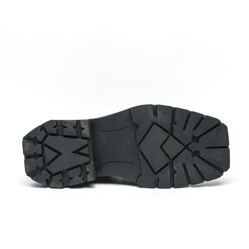 VDR_VANISH_05 punk motorcycle mid-calf boots in brown-black PU leather, styled for U.S. and EU urban streetwear. Close-up of a black shoe sole on a white background