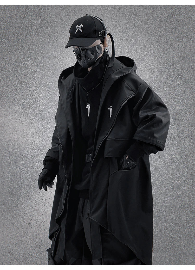 A male model in the Voidwear SIGNAL_VANISH_05 ☰, a minimalist and conceptual mid-sleeved hooded trench coat designed for stylish urban wear in the US and EU.
