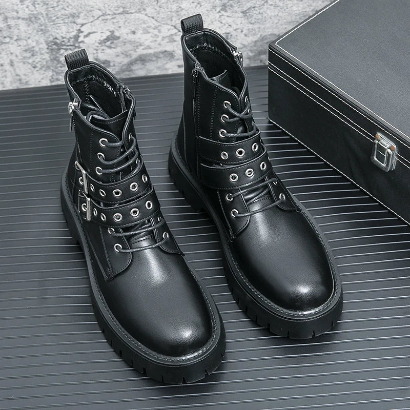 Pair of black leather boots with grommets on a textured surface.