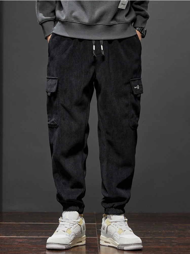 Diagram comparing Voidwear VX13 hybrid cargo joggers to traditional joggers and cargos