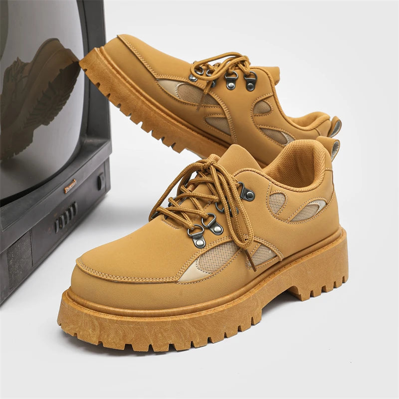 VOIDWEAR SIGNAL_VANISH_10 ☰ ankle-height PU leather boots with platform rubber outsole, mesh lining, and minimalist vanish design for spring/autumn. Pair of tan work boots on a white background with a vintage television set.
