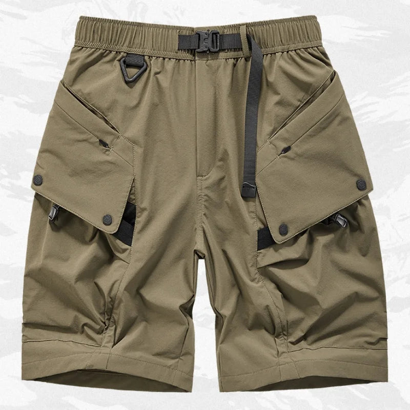 Khaki shorts with multiple pockets and a belt on a white background. Minimalist high-street tech-cargo shorts with embedded signal glyph, vanish-mode stitching, and quick-dry nylon-spandex fit for men