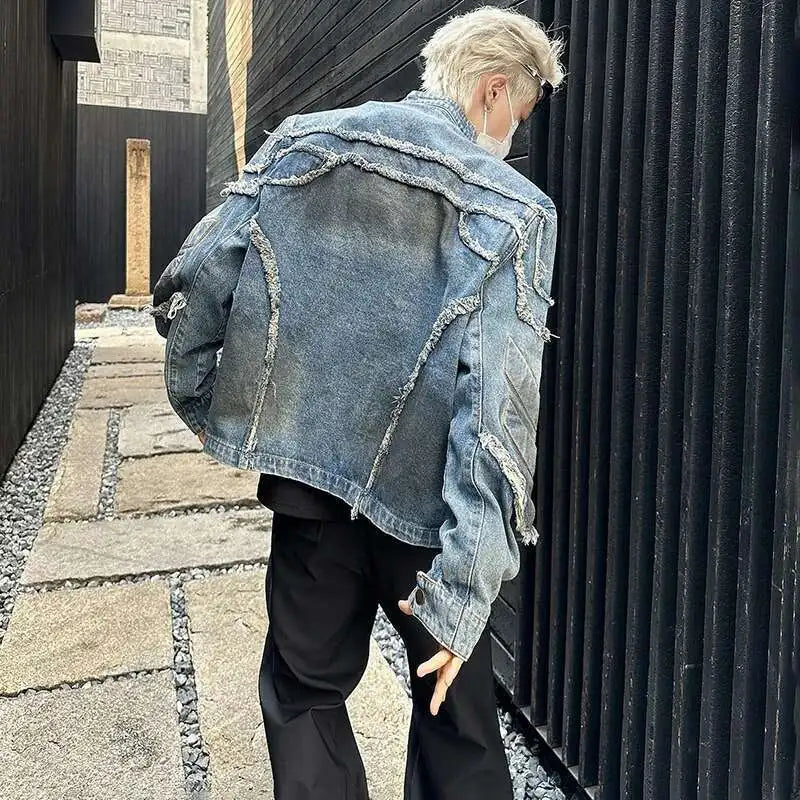 VOIDWEAR VDR//VANISH_05 denim motorcycle jacket with tassel shoulders and ritual glyph embroidery, styled for U.S. and EU streetwear culture.