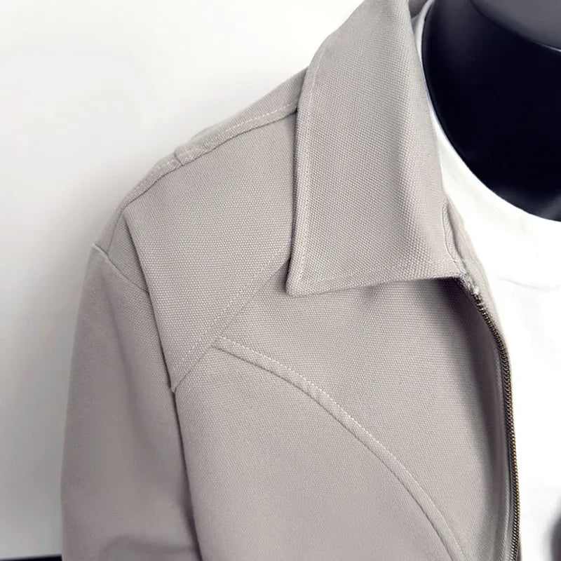 VOIDWEAR VDR_VANISH_05 ☰ black khaki jacket — ritual-inspired streetwear with signal glyph embroidery, minimalist techwear layering. Close-up of a gray coat with a collar on a white background