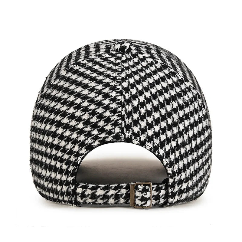 VOIDWEAR SIGNAL_SHADOW_07//◐ houndstooth plaid baseball cap with diamond label insignia and adjustable strap, styled in urban U.S. winter setting.