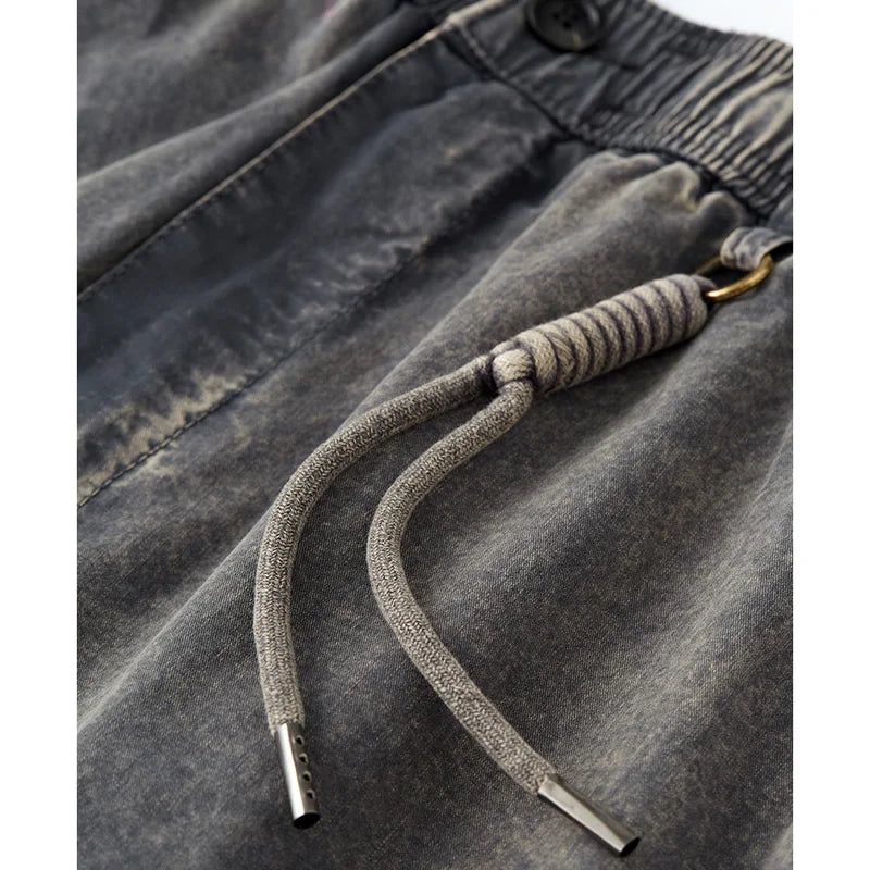 VOIDWEAR SIGNAL_SHIFT_09 ☰ loose cargo pants styled in Tokyo side street, pleated cotton texture and dirty-fit detailing visible