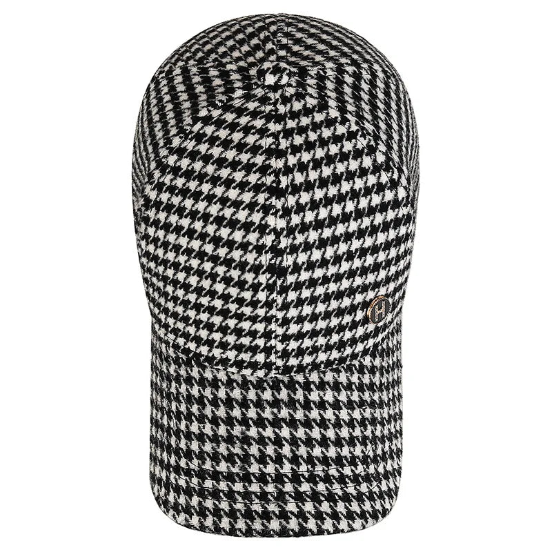 VOIDWEAR SIGNAL_SHADOW_07//◐ houndstooth plaid baseball cap with diamond label insignia and adjustable strap, styled in urban U.S. winter setting.