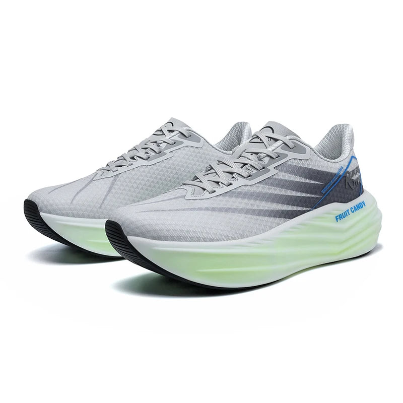 Gray running shoes with green sole on a white background